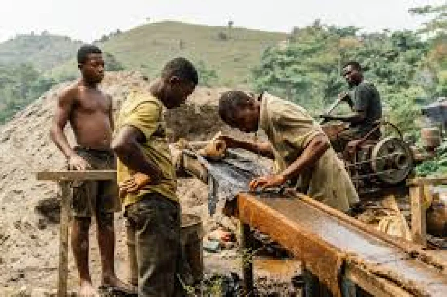 Galamsey miners in Anwiam sift through rock in search of gold. Photograph by Marisa Schwartz Taylor